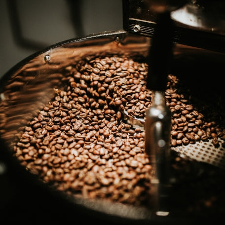 A large pot filled with coffee beans